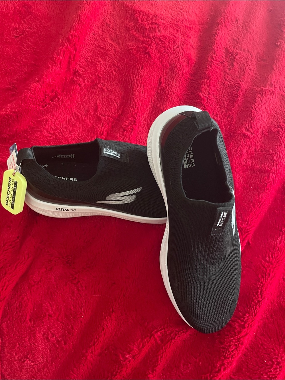 Skechers Black and White Slip-On Knit Sneakers